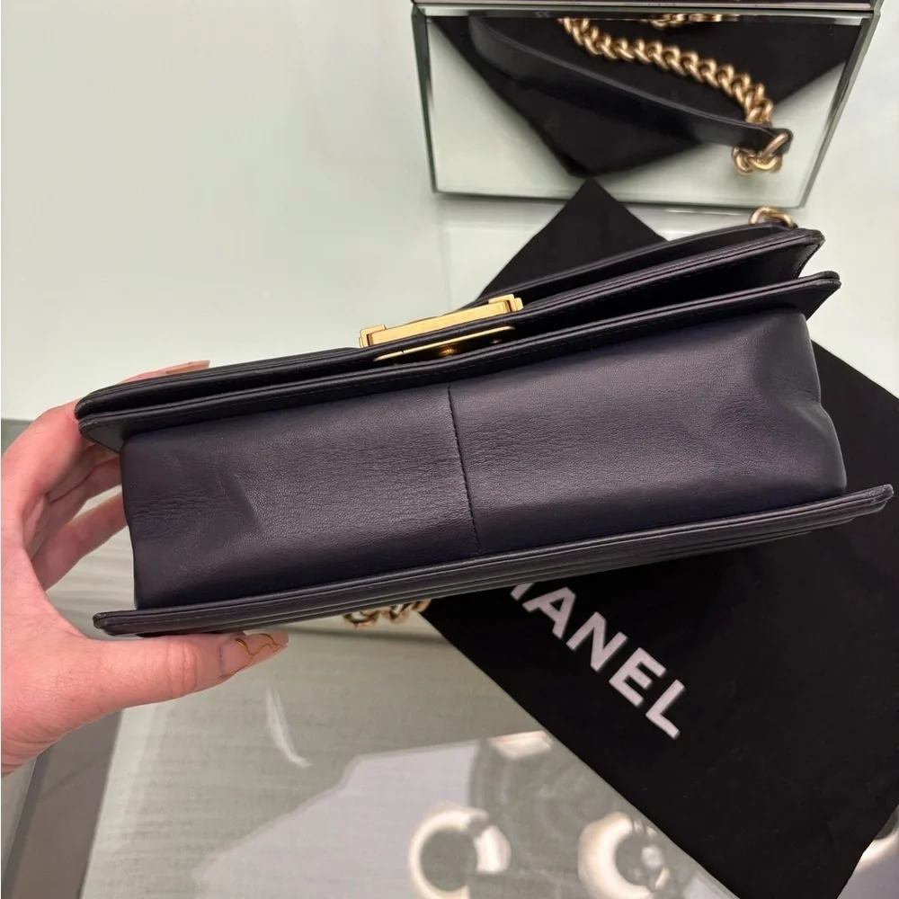 Authentic Chanel Quilted Médium Boy Flap Bag in Navy Blue